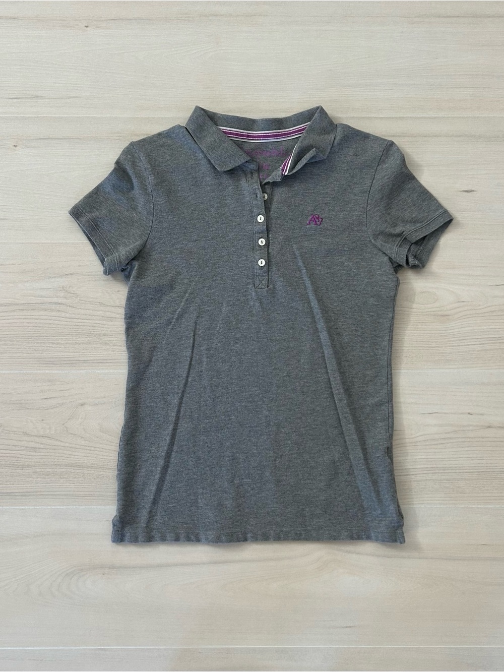 gray aeropostale and purple lettering polo